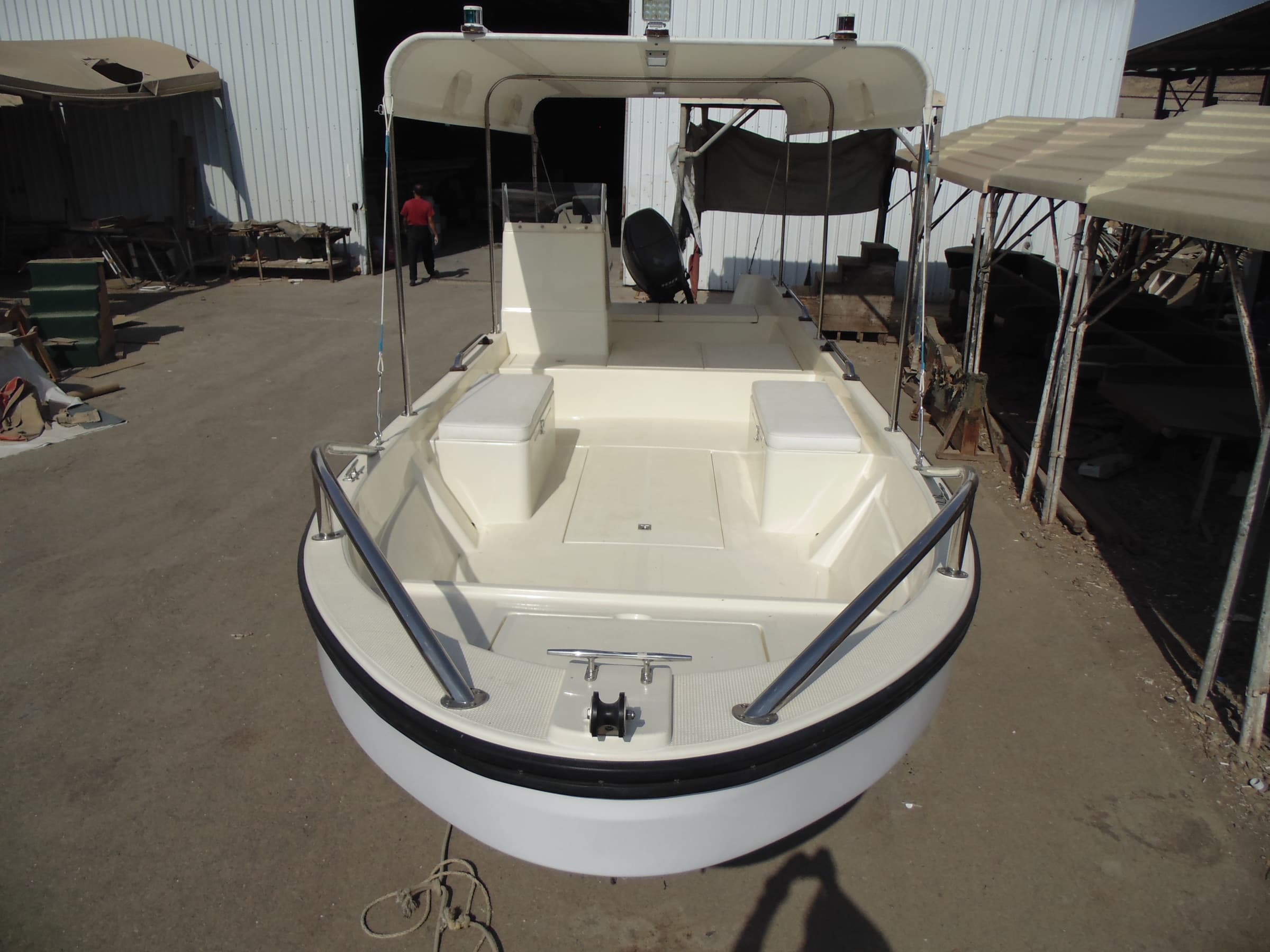 The 8.35 metre boat from the bow, with the full length canopy over the centre console.